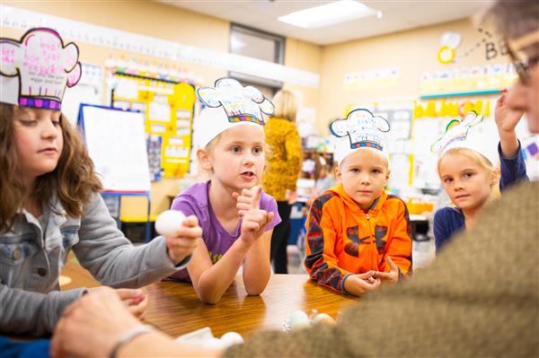 Students learning about Green Eggs and Ham and how to make them. 